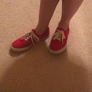 Red slip on sneakers